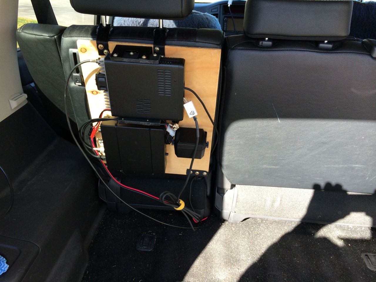 Main unit behind rear seat